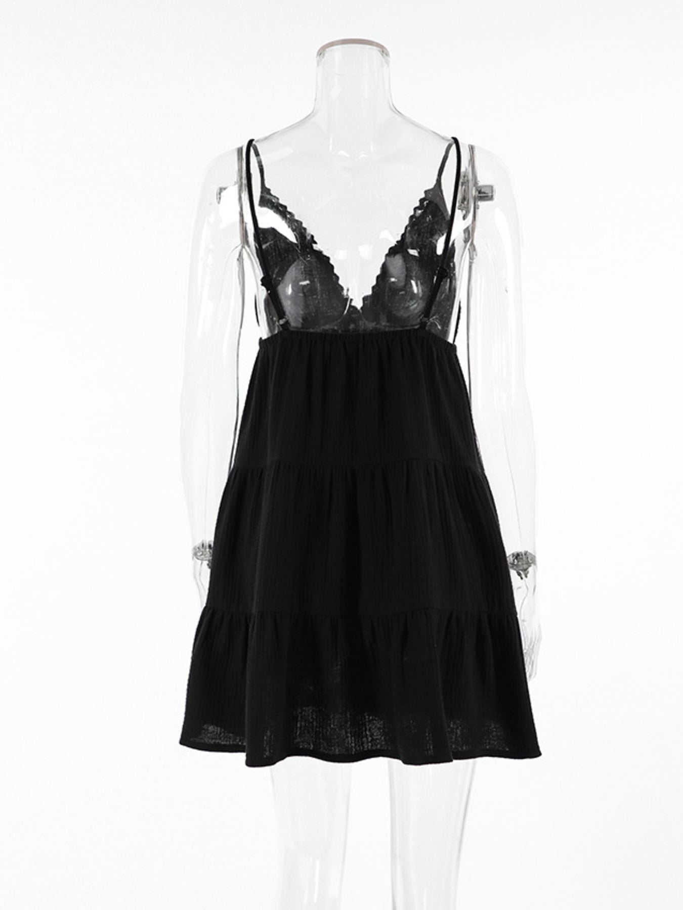 Black lace nightgown on a mannequin against a white background