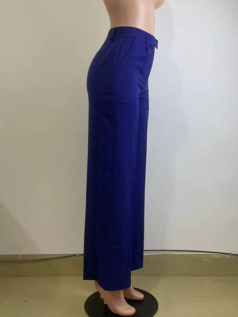 Blue pants on a mannequin against a plain background