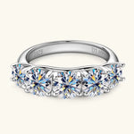 Silver ring with multiple gemstones on a white background