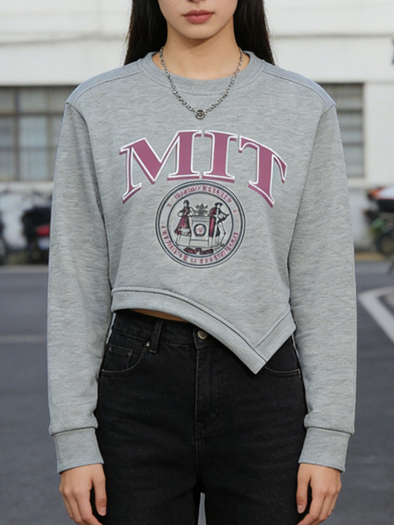 Person wearing a gray MIT sweatshirt with the institution's logo.