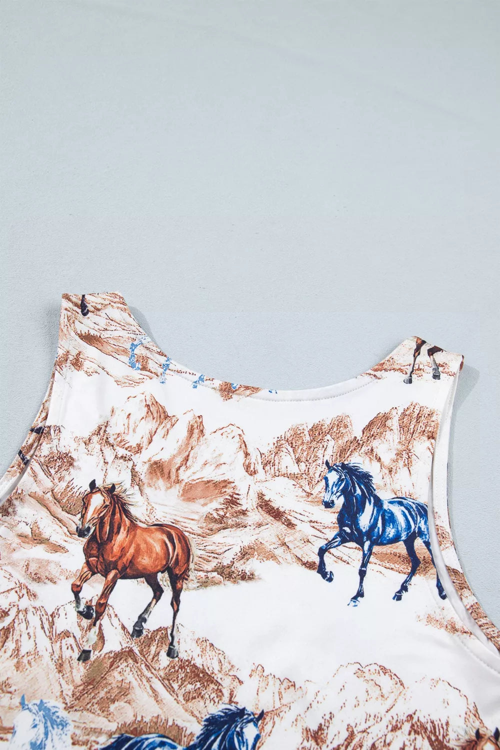 Shirt with horse print on a plain background