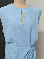 Light blue dress on a mannequin against a plain background