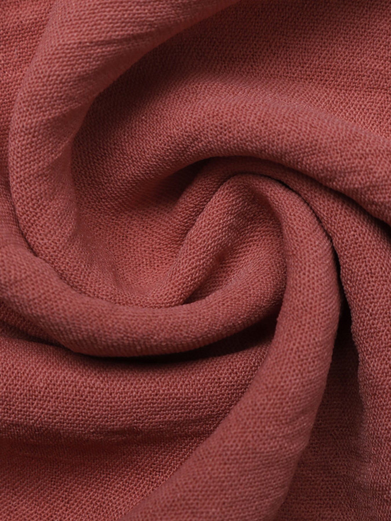 Close-up of a folded piece of red-brown fabric