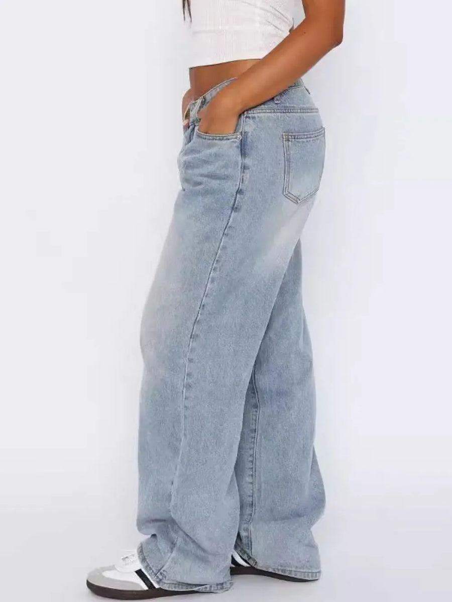 Light blue jeans worn by a person on a white background