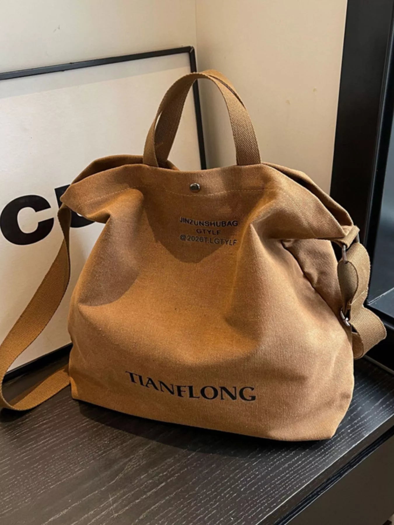 Brown bag with 'TIANFLONG' branding on a surface