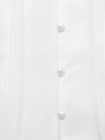 White shirt with pearl buttons on a white background