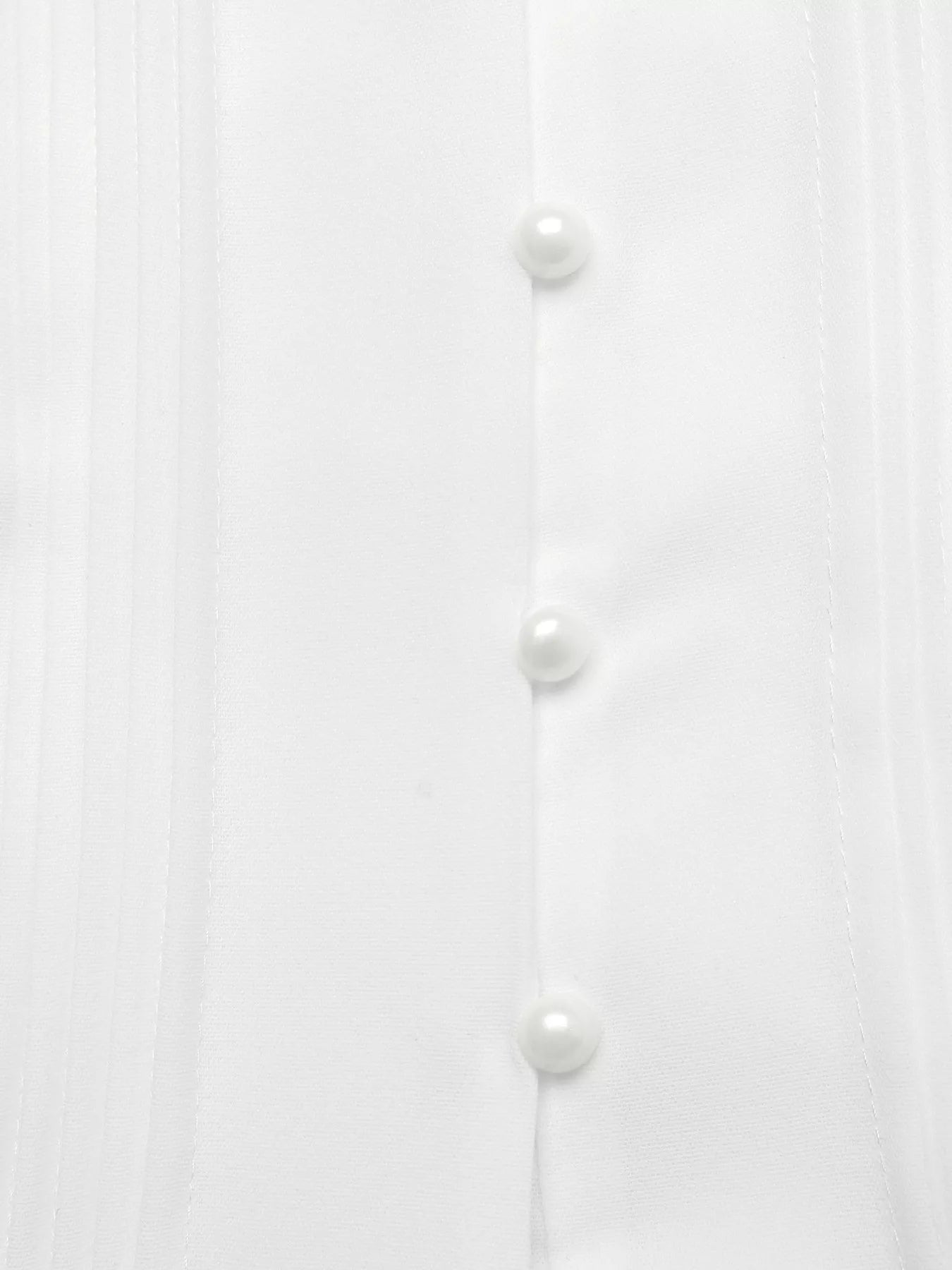 White shirt with pearl buttons on a white background