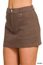 Brown skirt worn by a person on a white background