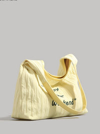 Yellow tote bag with text on a gray background