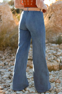 woman showing the back of High-Waisted Wide-Leg Button-Front Jeans