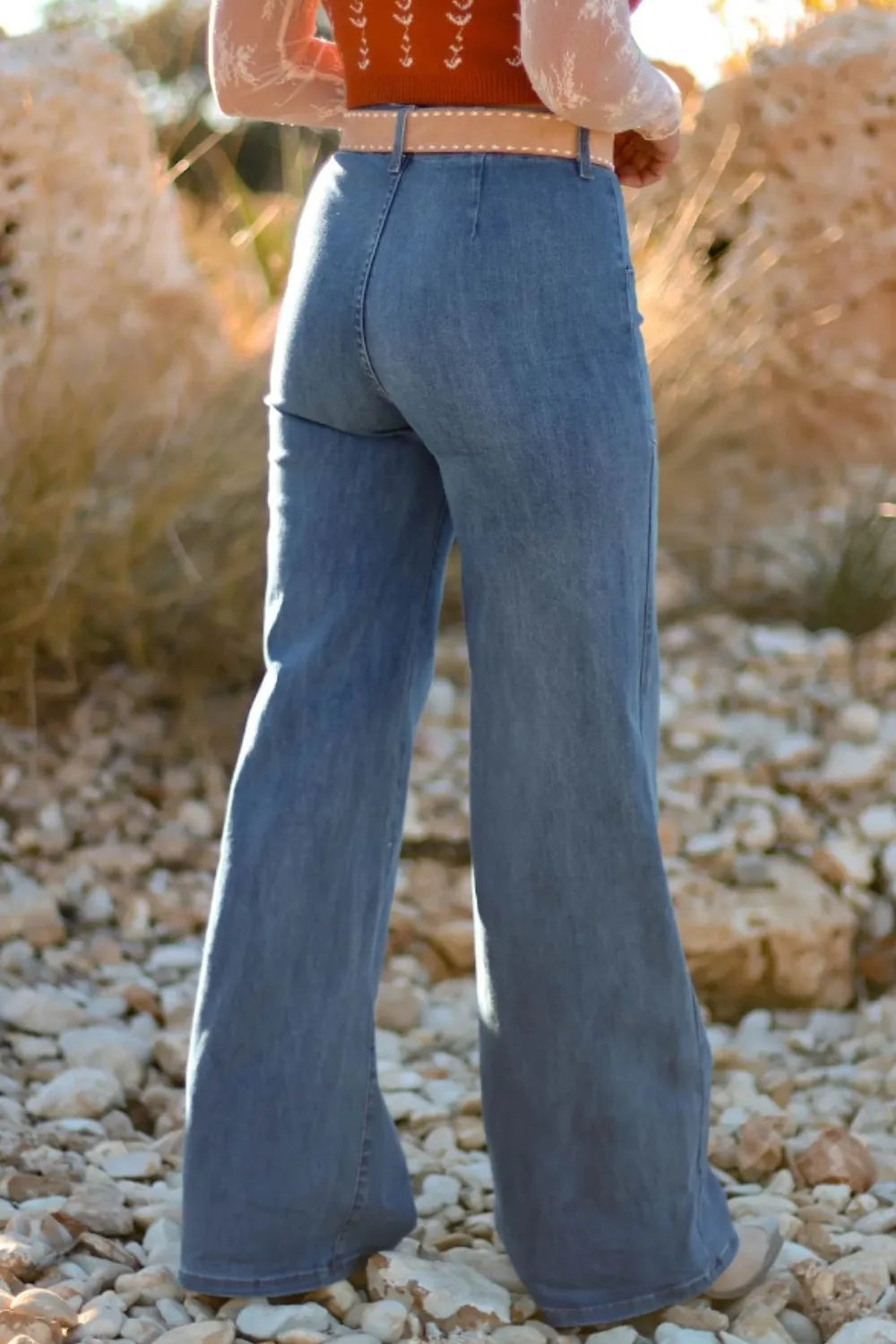 woman showing the back of High-Waisted Wide-Leg Button-Front Jeans