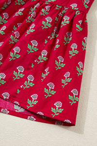 Red fabric with floral pattern on a beige surface