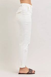 White pants worn by a person on a plain background