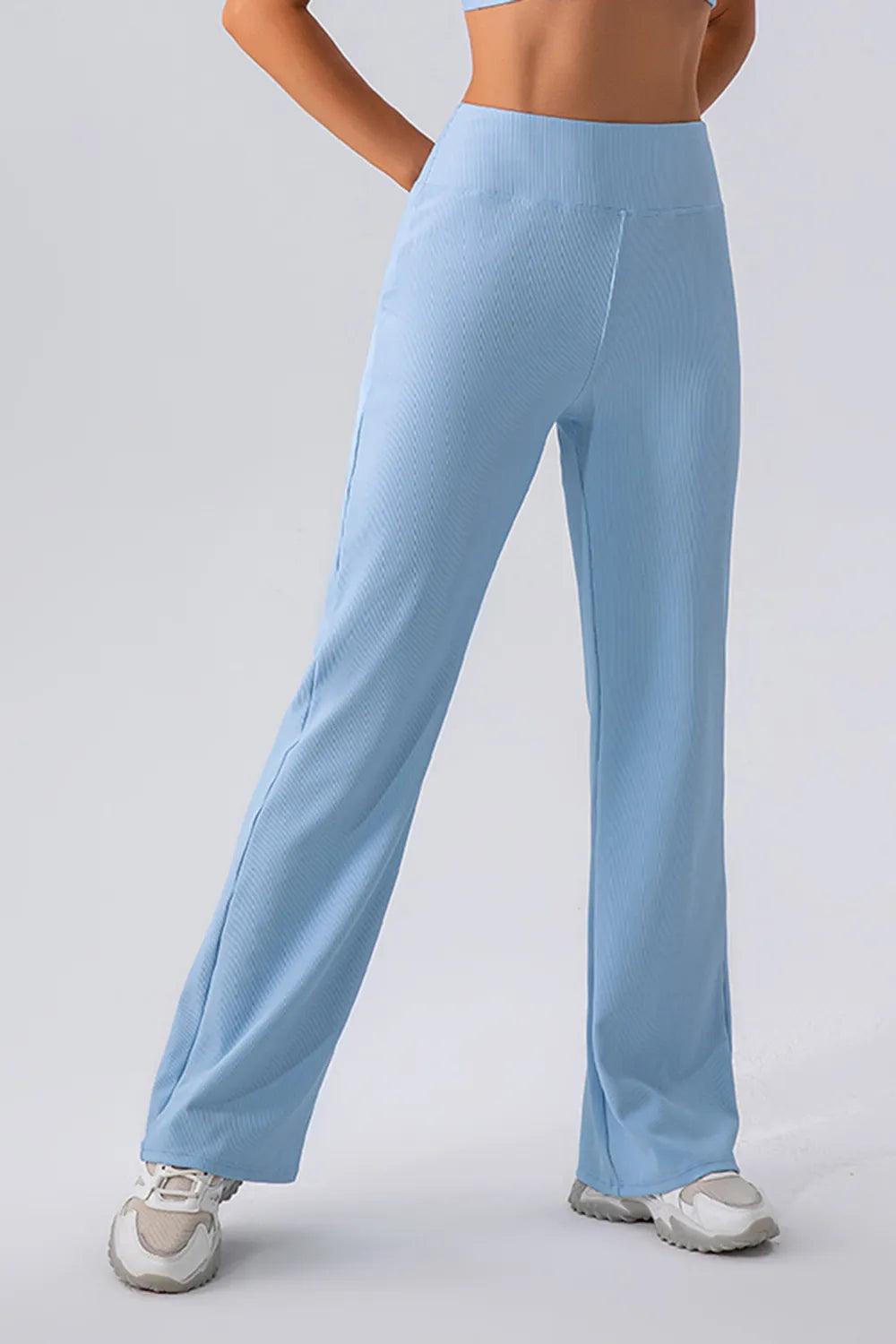 Light blue pants worn by a person on a plain background