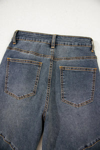 Back view of blue jeans with a white background