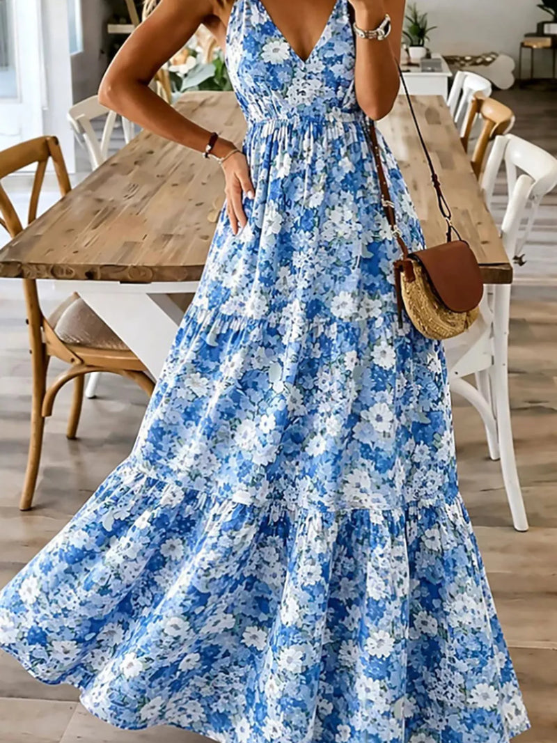 Woman wearing a blue floral dress in a dining room setting