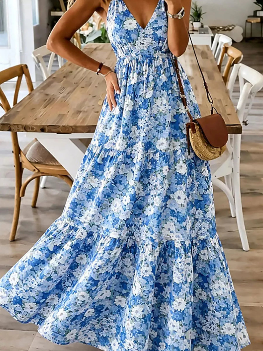 Woman wearing a blue floral dress in a dining room setting