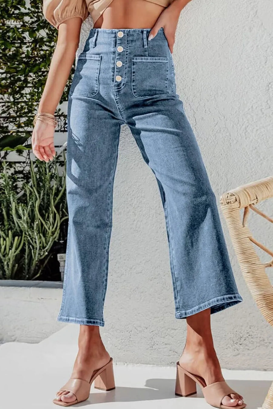 Person wearing blue jeans with a blurred background