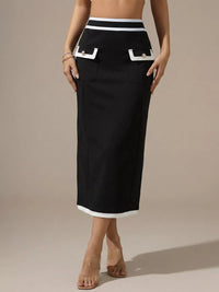 Black skirt with white trim worn by a person on a beige background