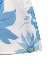 Close-up of a white fabric with blue floral patterns