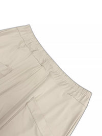 Beige pants with a white background
