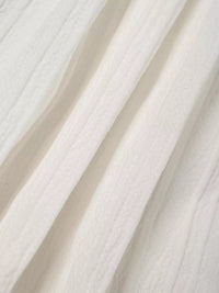 Close-up of white fabric with folds