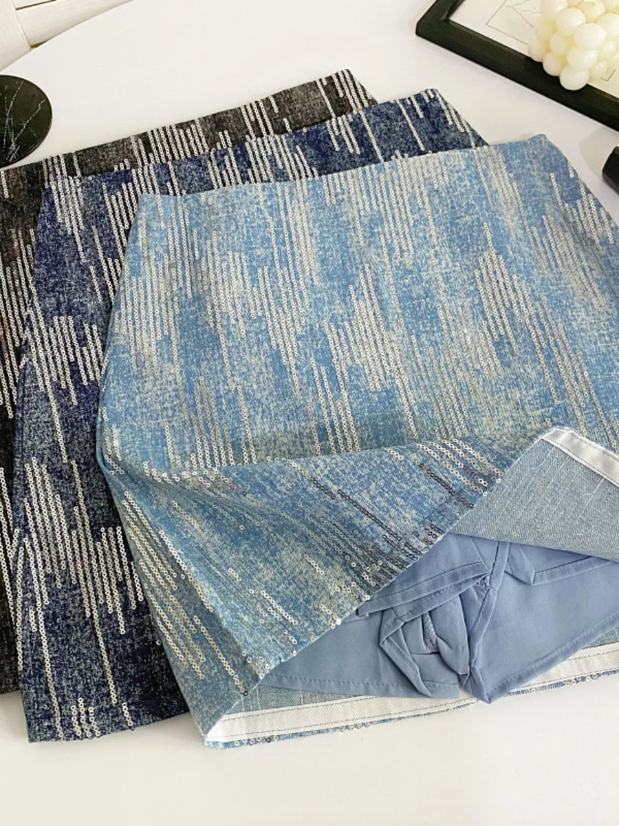 Two blue patterned rugs on a white surface