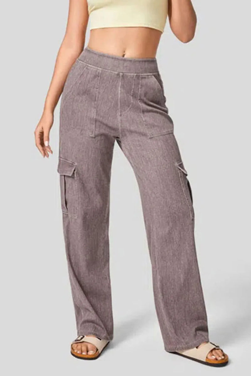 Person wearing brown cargo pants on a plain background