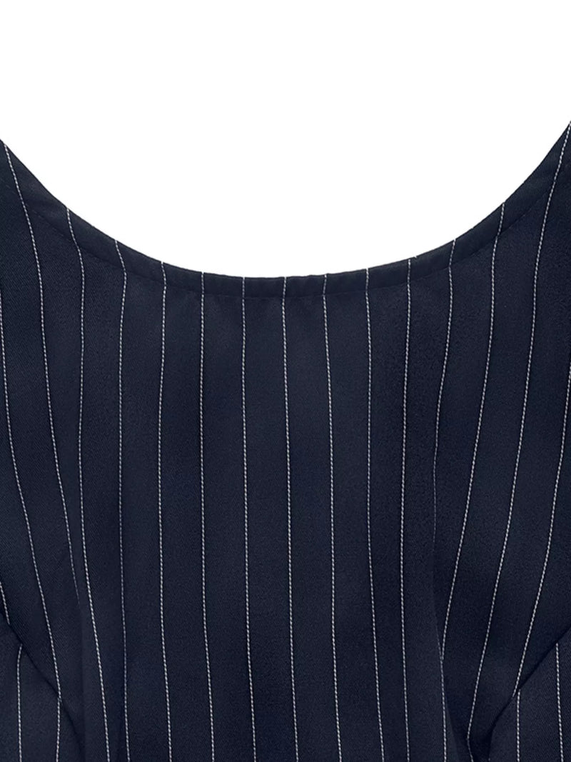 Close-up of a navy blue pinstripe suit jacket on a white background