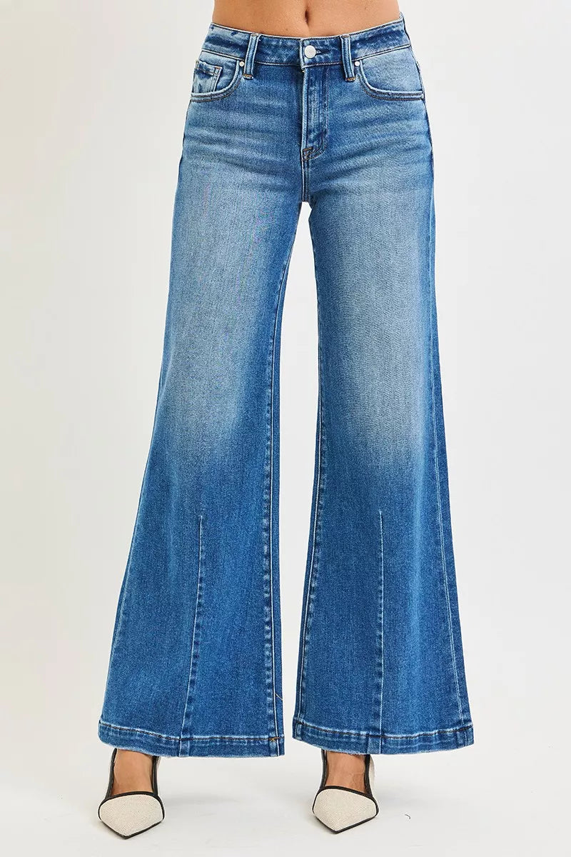 Blue flared jeans on a white background