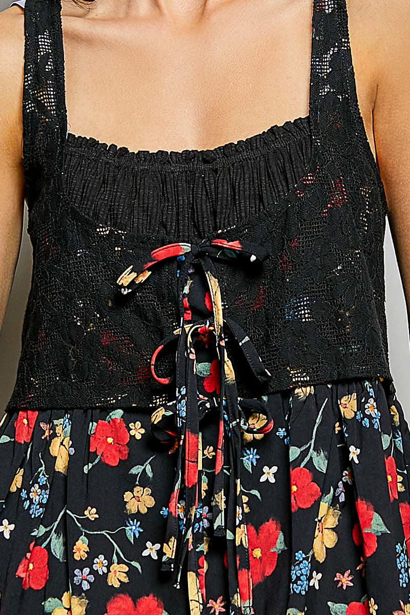 Black floral apron with colorful flowers on a plain background