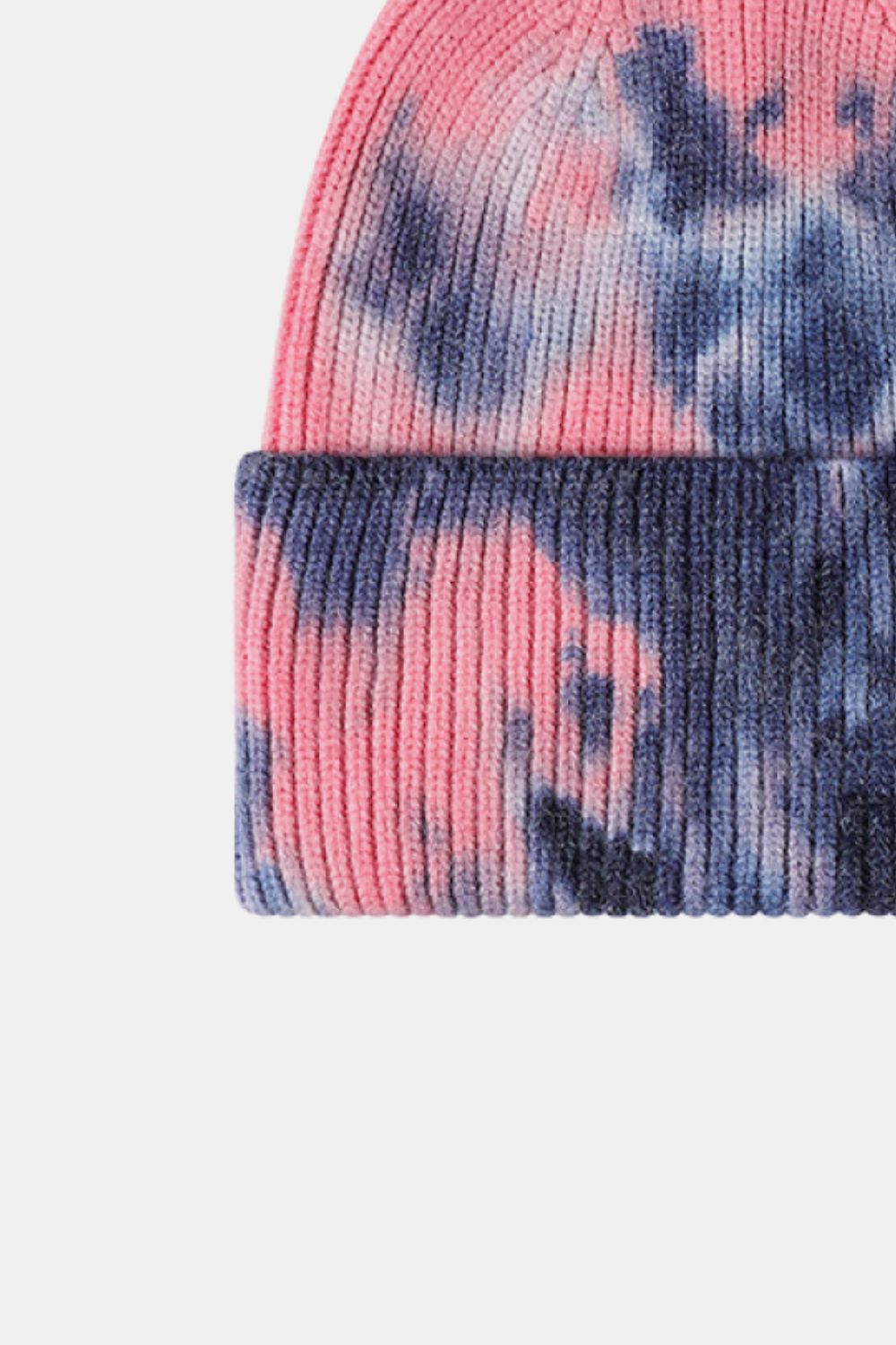 Tie-dye beanie with pink and blue patterns on a white background
