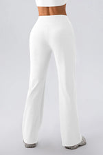 White wide-leg pants worn by a person on a light gray background