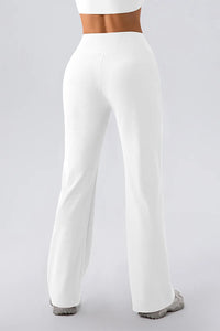 White wide-leg pants worn by a person on a light gray background