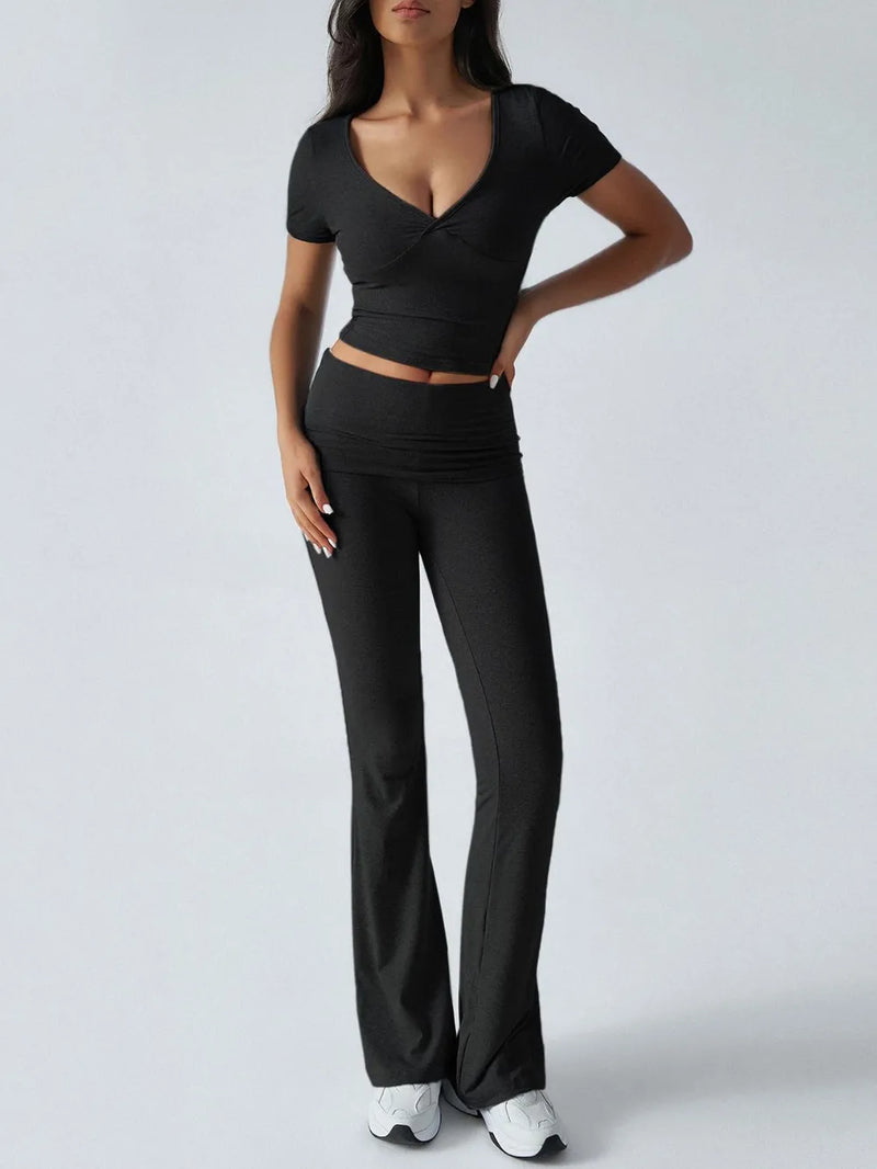 Person wearing a black outfit with a white background