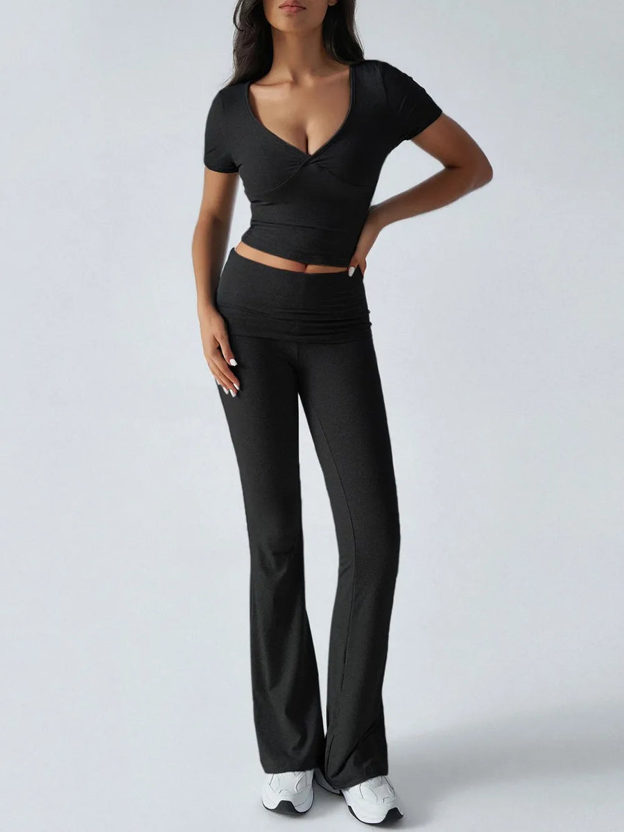 Person wearing a black outfit with a white background