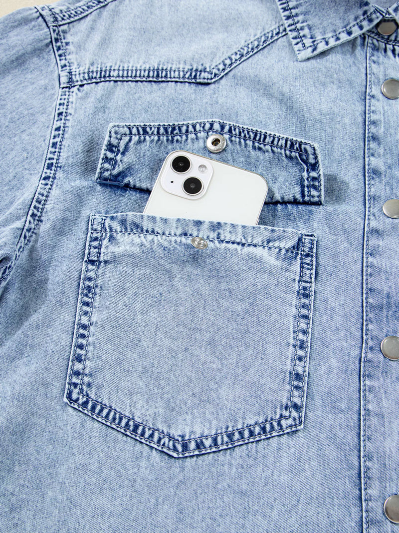 White phone in a blue denim pocket