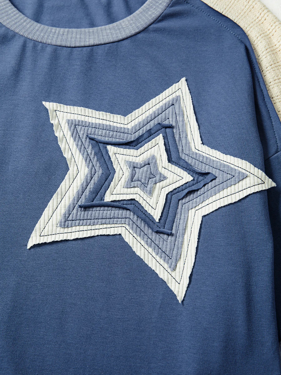 Blue shirt with a star-shaped design on a plain background