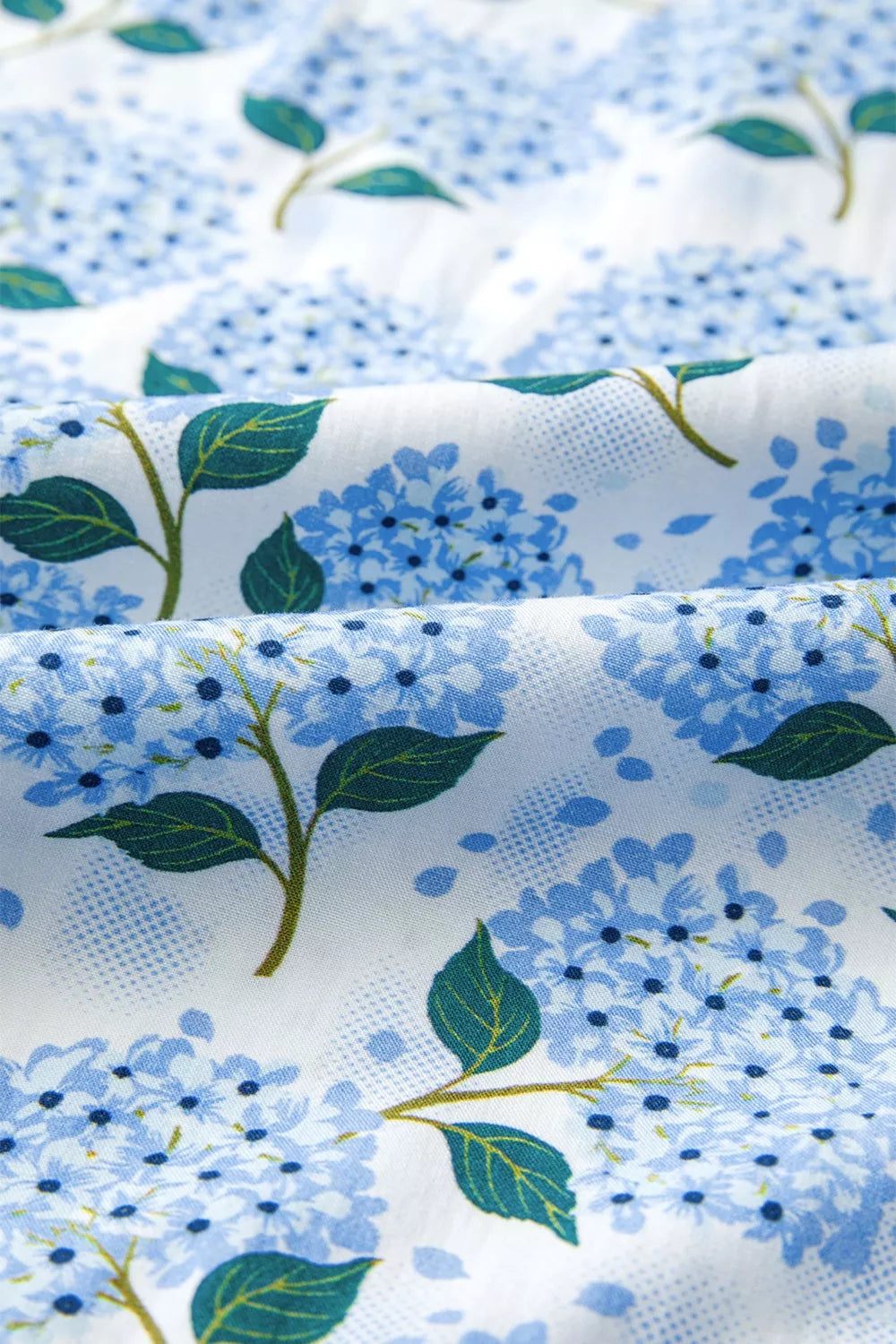 Close-up of fabric with blue floral pattern