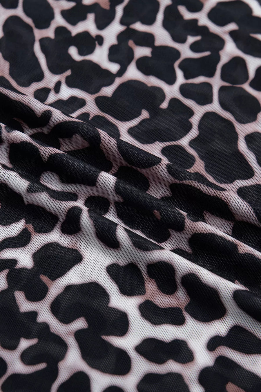 Close-up of fabric with black and white abstract pattern