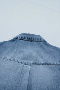 Blue denim jacket on a light gray background