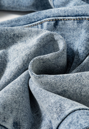 Close up view of fabric on Washed Wide Leg Jeans with Pockets