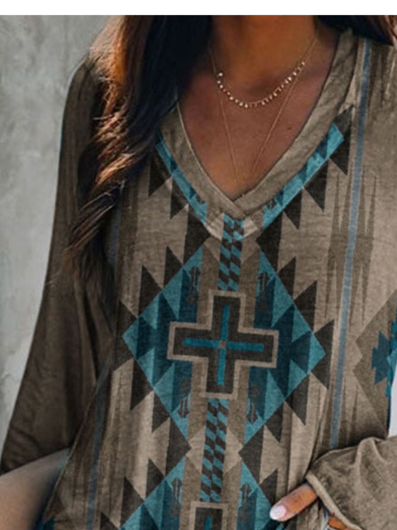 Person wearing a patterned shirt with geometric design