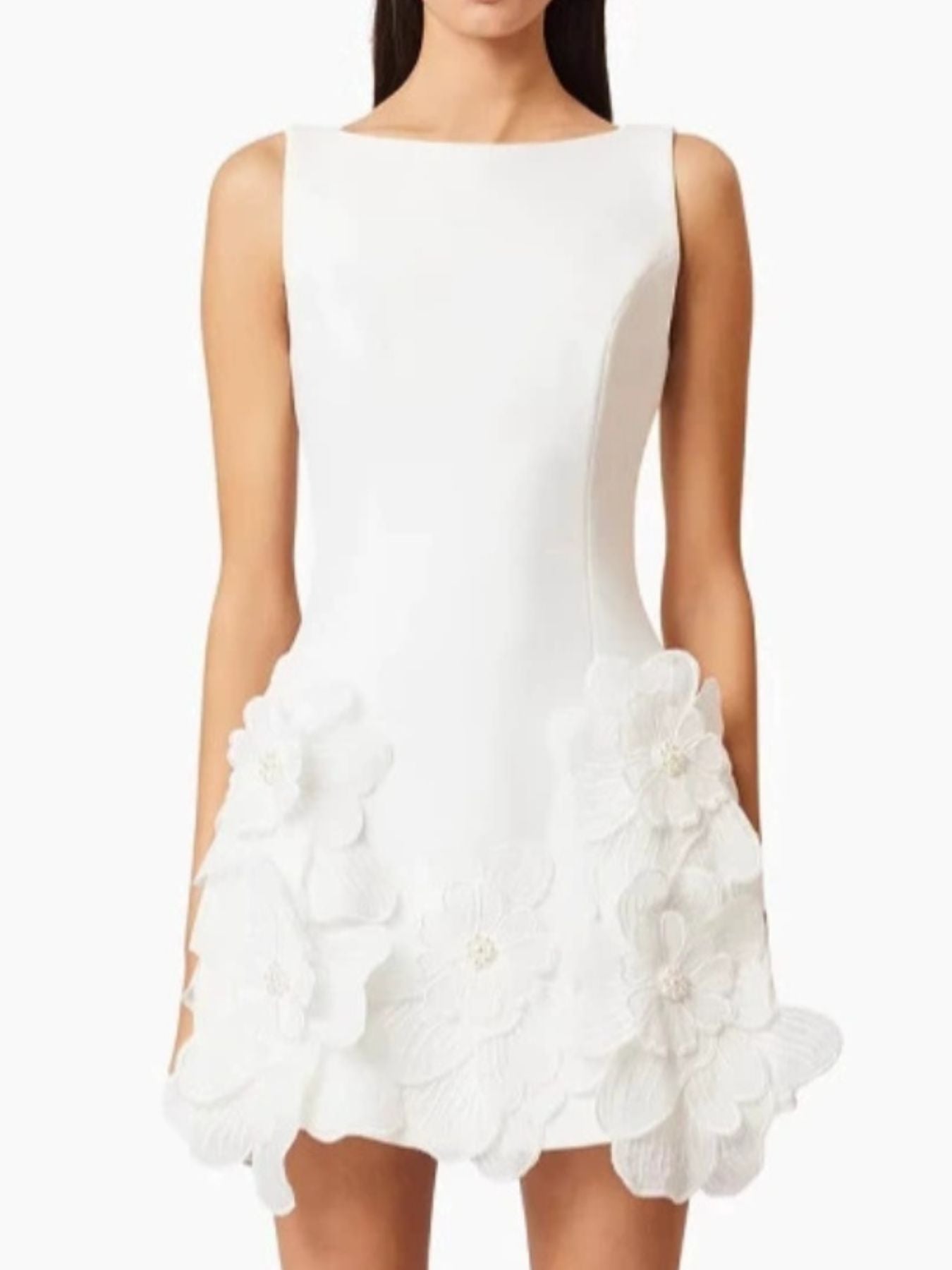 White dress with floral details on a white background