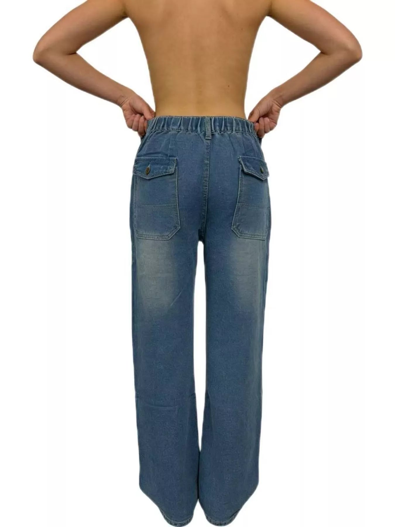Blue jeans worn by a person on a white background