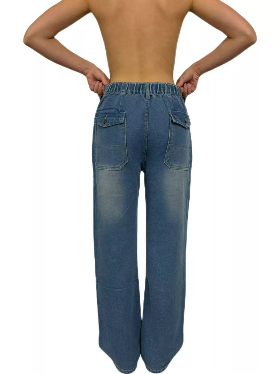 Blue jeans worn by a person on a white background