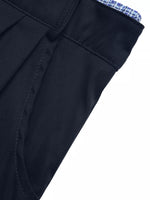 Close-up of a dark blue suit jacket with a white background