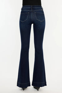 Dark blue flared jeans on a white background
