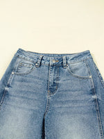 Blue jeans on a beige background