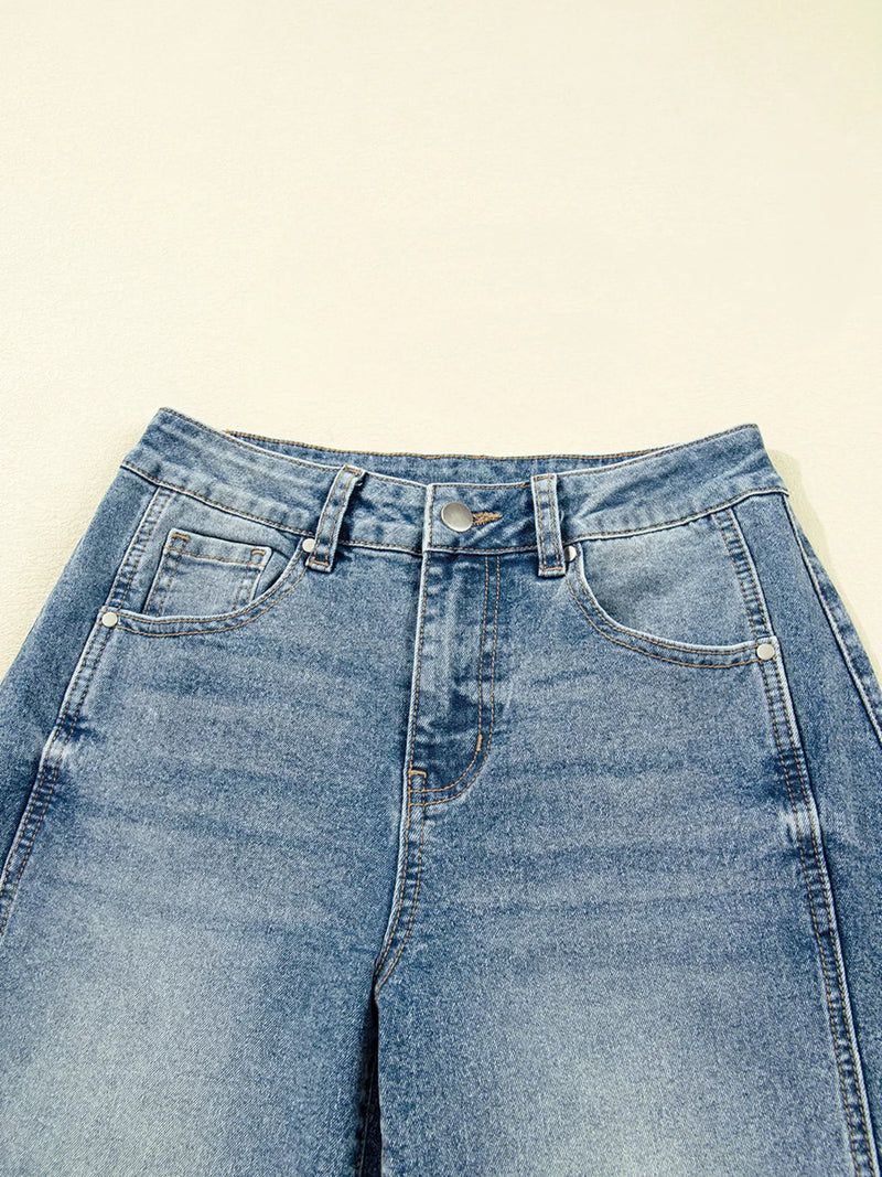 Blue jeans on a beige background